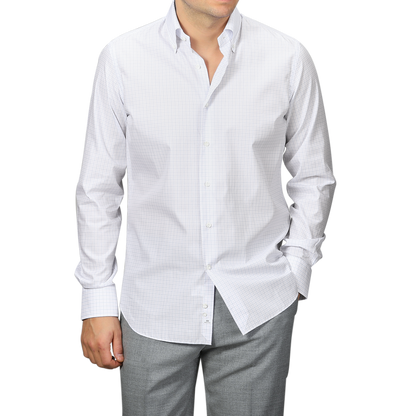 An individual wearing an Alessandro Gherardi Pink Blue Gingham Checked Cotton BD Shirt with gray pants stands against a plain background.