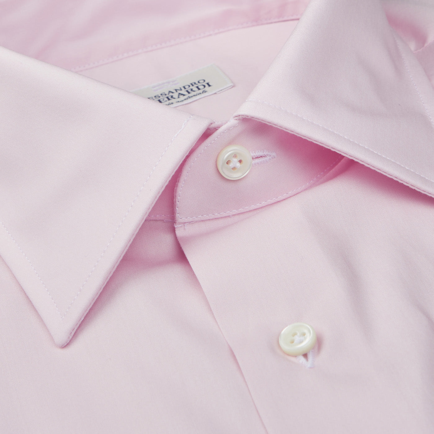 A close up of a high-quality Alessandro Gherardi Pink Fine Cotton Single Cuff Shirt with handmade buttonholes.