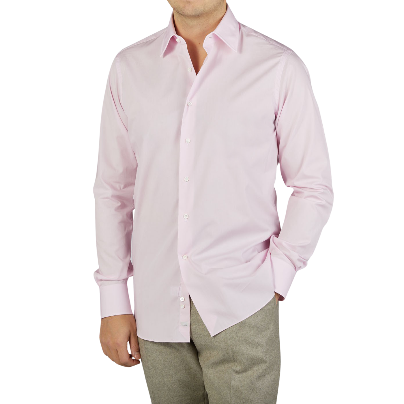 A man wearing a high-quality Alessandro Gherardi Pink Fine Cotton Single Cuff Shirt and slacks.