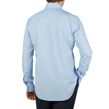 A man with a back view wearing an Alessandro Gherardi Sky Blue Fine Cotton Single Cuff Shirt.