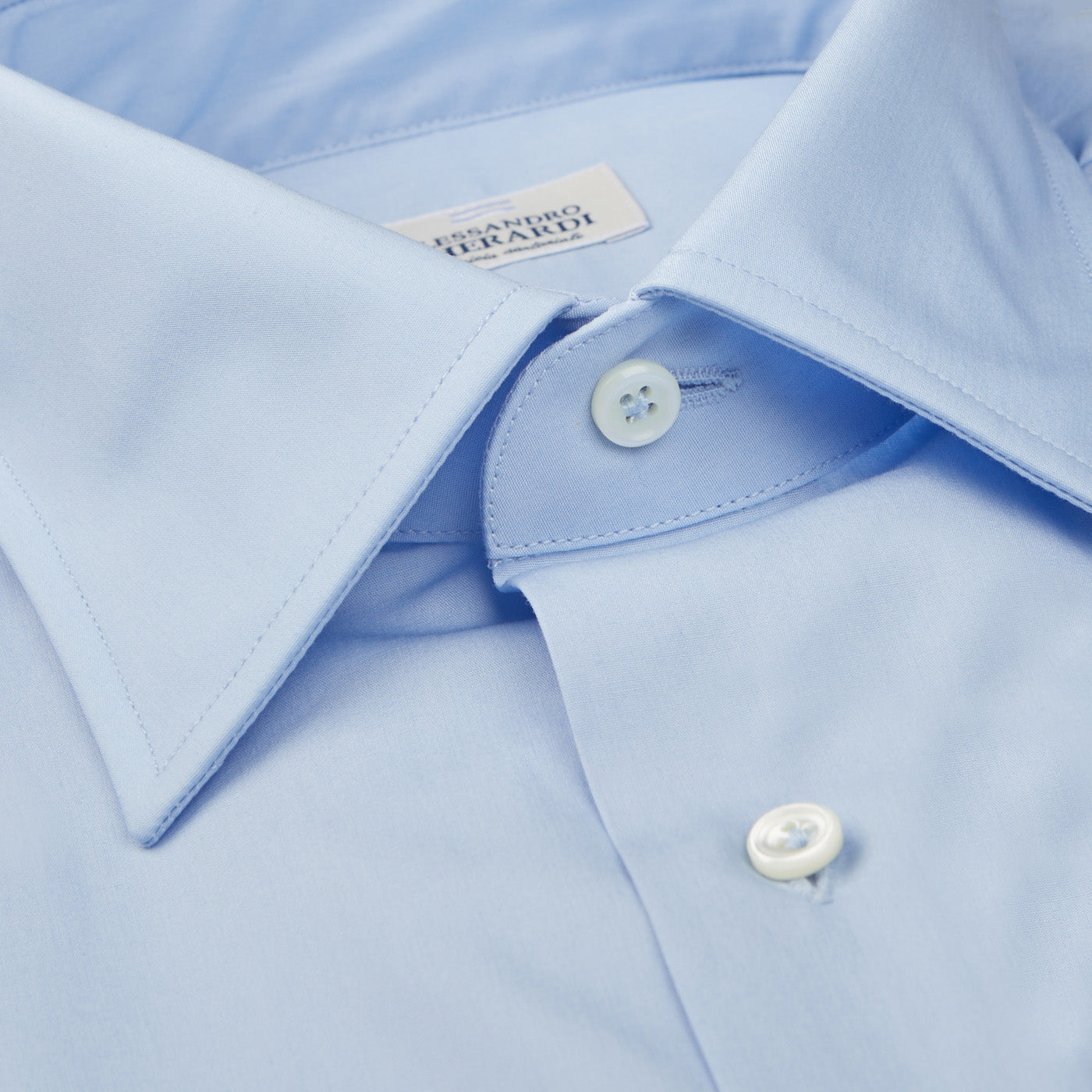 A high-quality Alessandro Gherardi men's shirt in a Tuscan countryside setting, featuring a close up of the Sky Blue Fine Cotton Single Cuff Shirt.