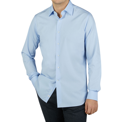 A man wearing an Alessandro Gherardi Sky Blue Fine Cotton Single Cuff Shirt.