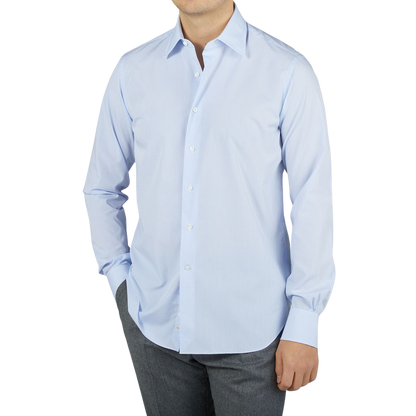 A man wearing a high-quality Alessandro Gherardi Sky Blue Grid Check Cotton Single Cuff Shirt.