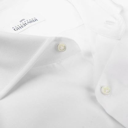 Close-up of a high-quality men's shirt with a buttoned collar. This pure cotton, White Cotton Twill Single Cuff Shirt features a label reading "Alessandro Gherardi.