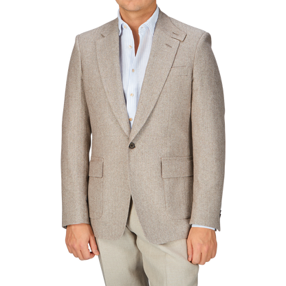 A man wearing an Alexander Kraft Monte Carlo Beige Herringbone Wool Linen Provence Jacket.