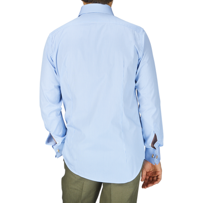 The man is wearing an Alexander Kraft Monte Carlo Blue White Bengal Stripe Cotton Double Cuff Shirt with a fitted cut.
