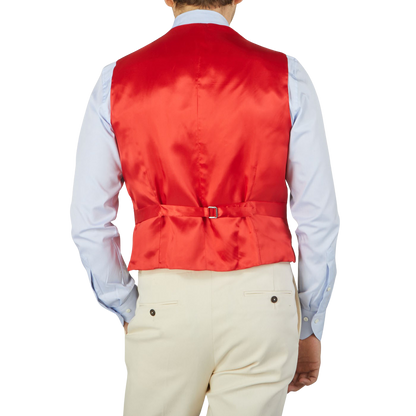 The back view of a man wearing an Alexander Kraft Monte Carlo Light Beige Cotton Twill DB Waistcoat.