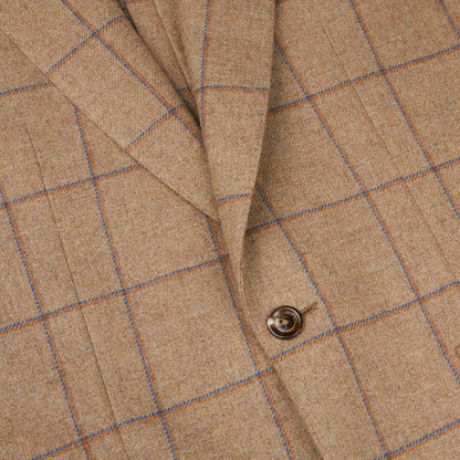 A close up of a Caramel Estate Wool Tweed Provence jacket with blue buttons, designed by Alexander Kraft Monte Carlo.