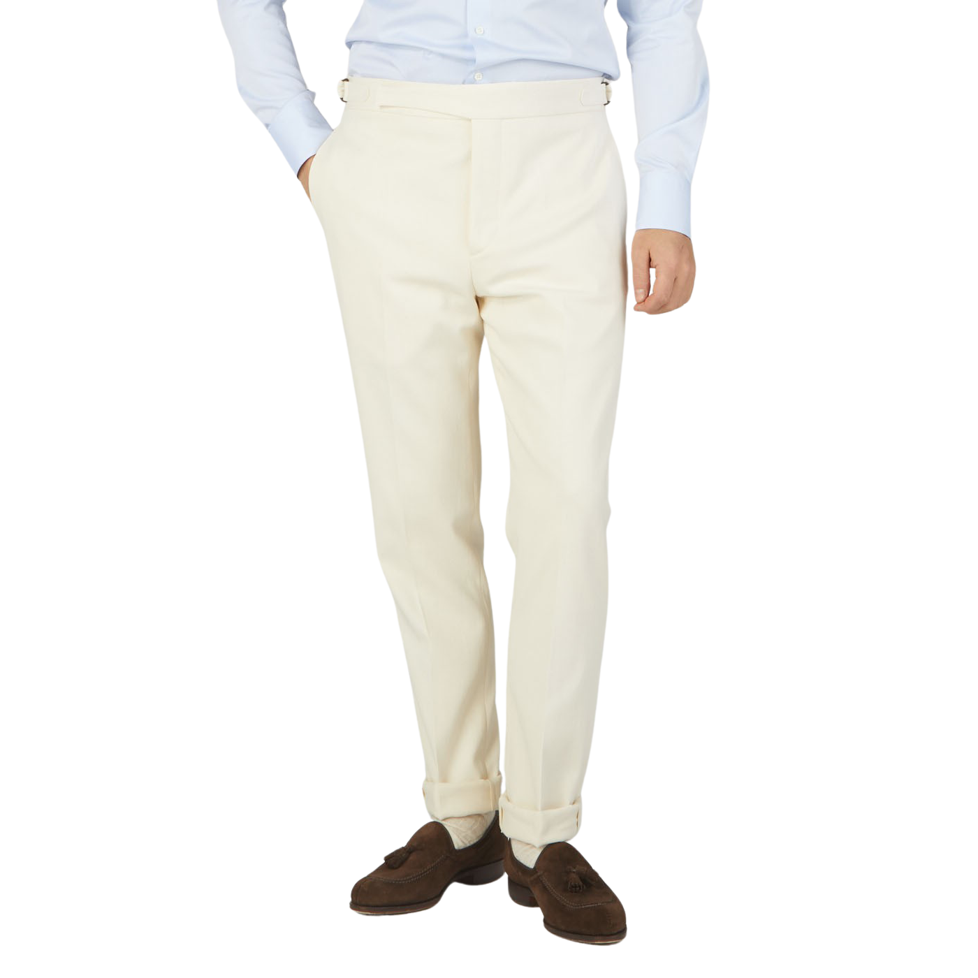 The man is dressed in a white suit, consisting of formal Cream White Cotton Twill Updated Gurkha Trousers and a slim-cut blue shirt from Alexander Kraft Monte Carlo.