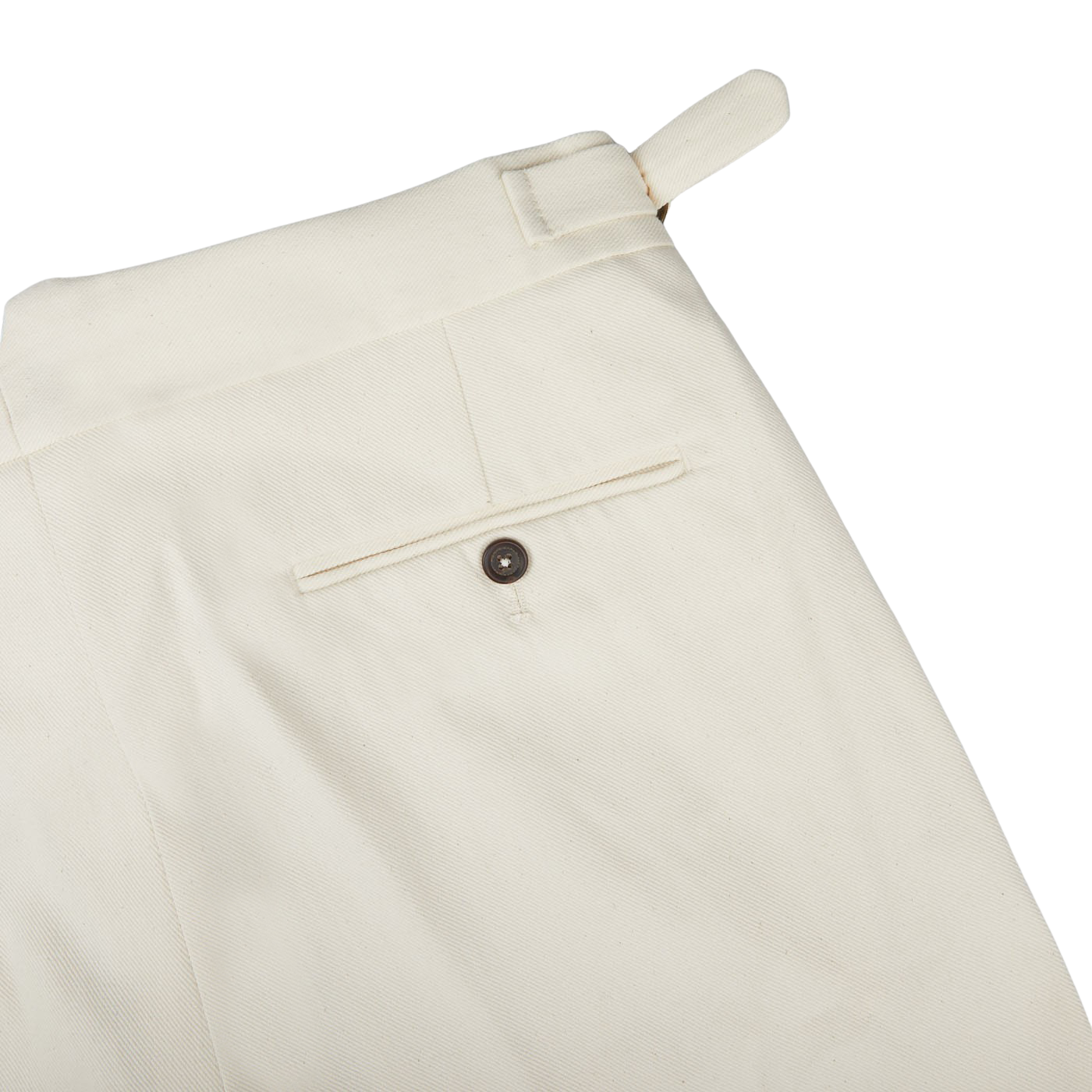 A close-up of Alexander Kraft Monte Carlo Cream White Cotton Twill Updated Gurkha Trousers with buttons, perfect for formal attire.