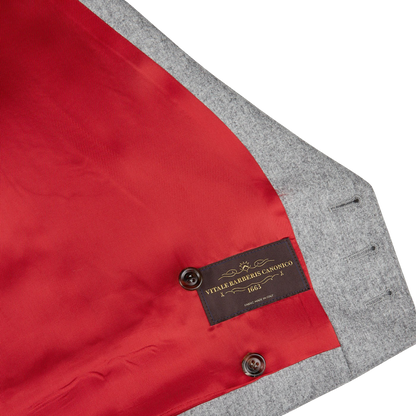 A red and grey Light Grey VBC Wool Flannel DB Waistcoat with a label on it made of pure wool flannel by Alexander Kraft Monte Carlo.