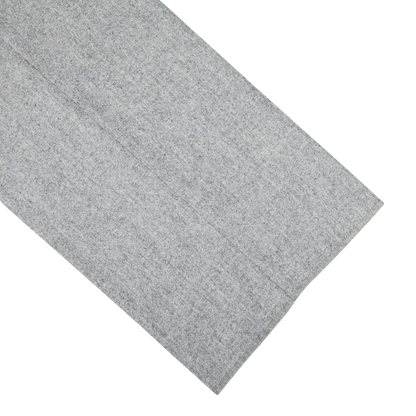 A Light Grey VBC Wool Flannel Riviera Trousers napkin on a white surface by Alexander Kraft Monte Carlo.