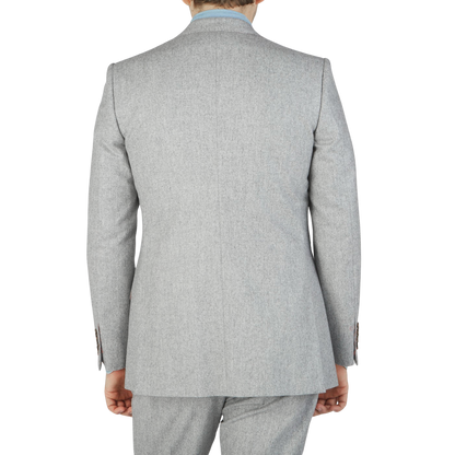 The back view of a man wearing an Alexander Kraft Monte Carlo Light Grey VBC Wool Flannel Signature Jacket.