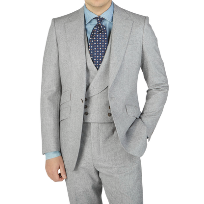 A man in a light grey VBC Wool Flannel Signature Jacket by Alexander Kraft Monte Carlo posing for a photo.