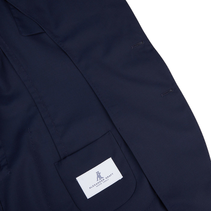 The back of a Navy Blue Loro Piana Wool Unstructured PPJ Jacket with an Alexander Kraft Monte Carlo label on it.