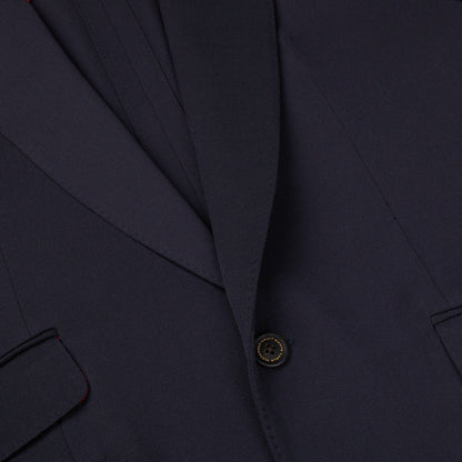 A close up of an Alexander Kraft Monte Carlo navy blue textured worsted wool signature jacket with red detailing.