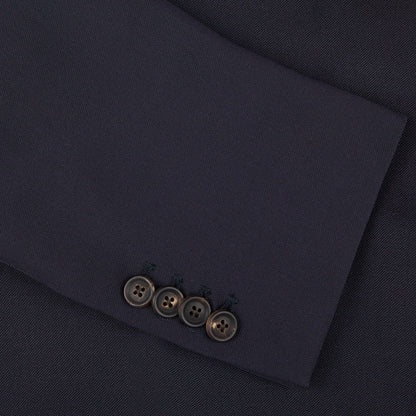 A close up of an Alexander Kraft Monte Carlo navy blue textured worsted wool signature jacket with buttons.