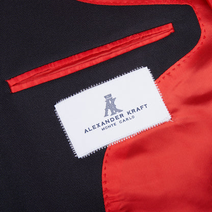 An Alexander Kraft Monte Carlo Navy Blue Textured Worsted Wool Signature Jacket in black and red with a label on it.