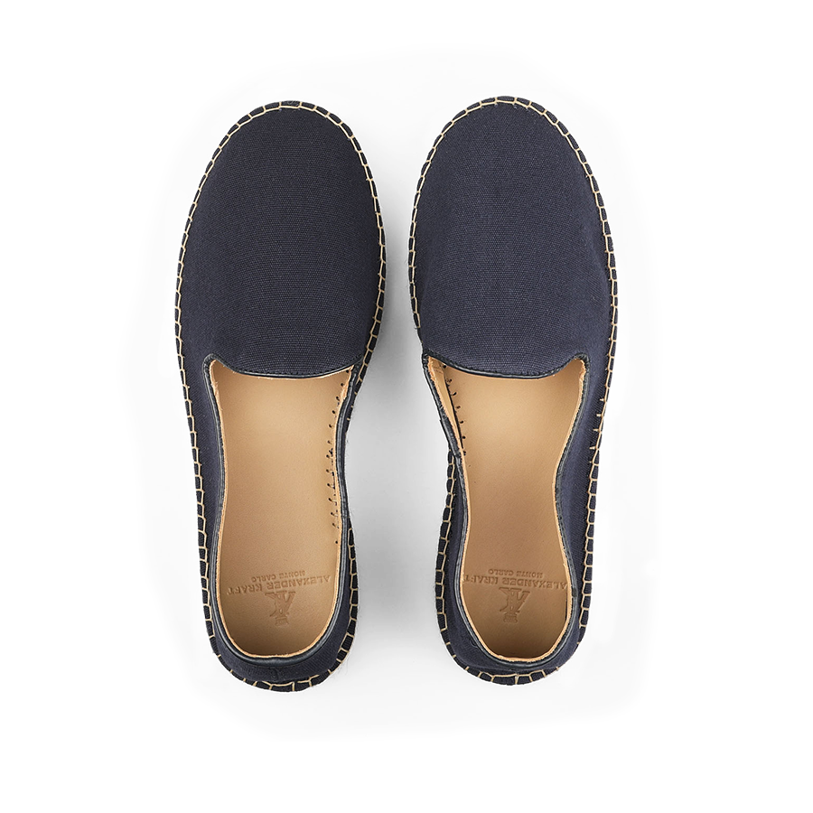 A pair of Dark Blue Cotton Luxury Espadrilles from Alexander Kraft Monte Carlo, featuring tan insoles, shown from above on a black background.