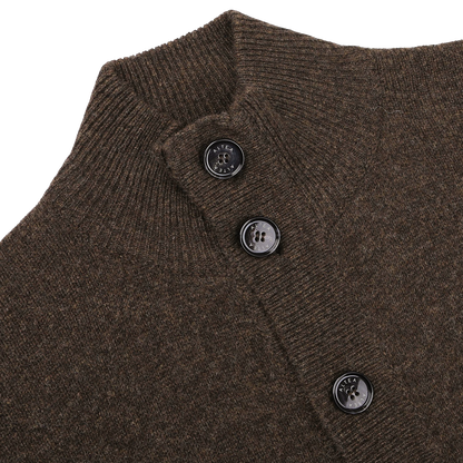Close-up of the Dark Brown Shetland Wool Button Cardigan by Altea, featuring a ribbed collar and four black buttons along the front placket.