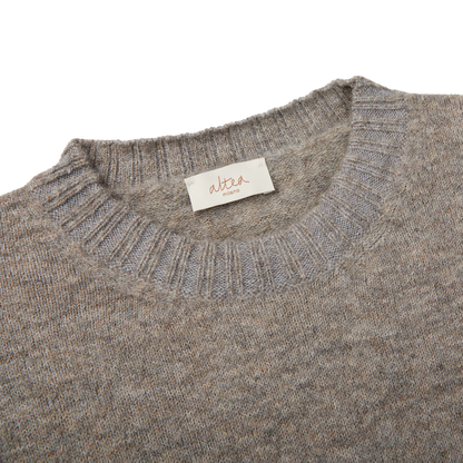 A seasonal Altea grey melange wool alpaca crewneck sweater with a label on it.