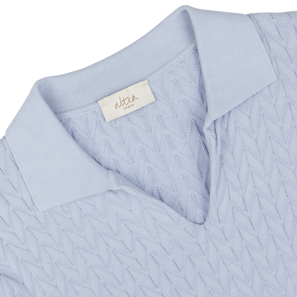 Light blue knitted sweater, made in Italy, with an Altea brand label at the neckline.