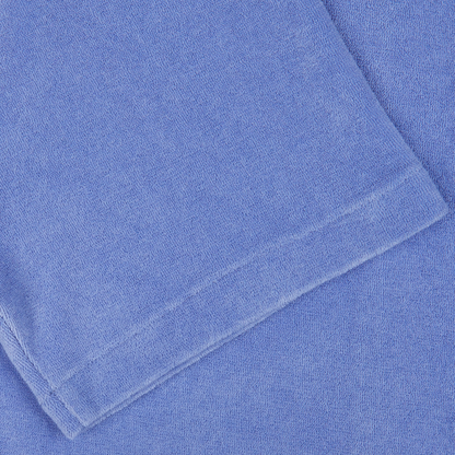 Close-up of a neatly folded Altea Light Blue Cotton Towelling Capri Collar Shirt with a visible texture.