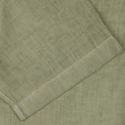 Close-up of a folded Altea Moss Green Linen Blend Camp Collar Shirt with a textured weave.
