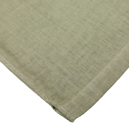 Close-up of a textured Altea Moss Green Linen Blend Camp Collar Shirt with a folded corner.