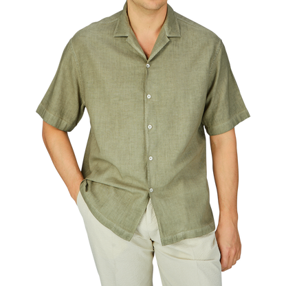 Man wearing a casual Altea Moss Green Linen Blend Camp Collar Shirt and light trousers, ideal as a summer essential.