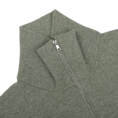An up-close image of the Altea Moss Green Wool Fleece 1/4 Zip Sweater, showcasing its high collar and cozy wool blend construction.