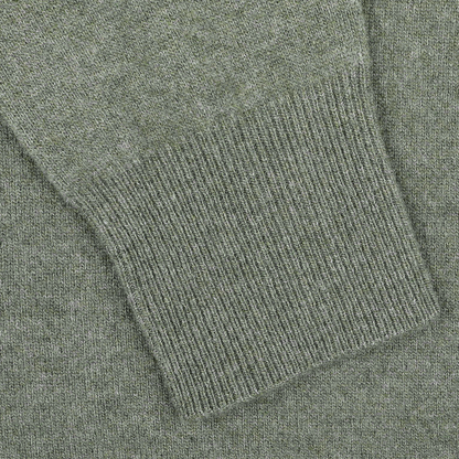 Close-up of the sleeve on Altea's Moss Green Wool Fleece 1/4 Zip Sweater, featuring ribbed cuff detailing and made from a cozy wool blend.