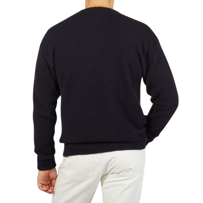 The back view of a man wearing an Altea Navy Blue Wool Alpaca Crewneck Sweater.