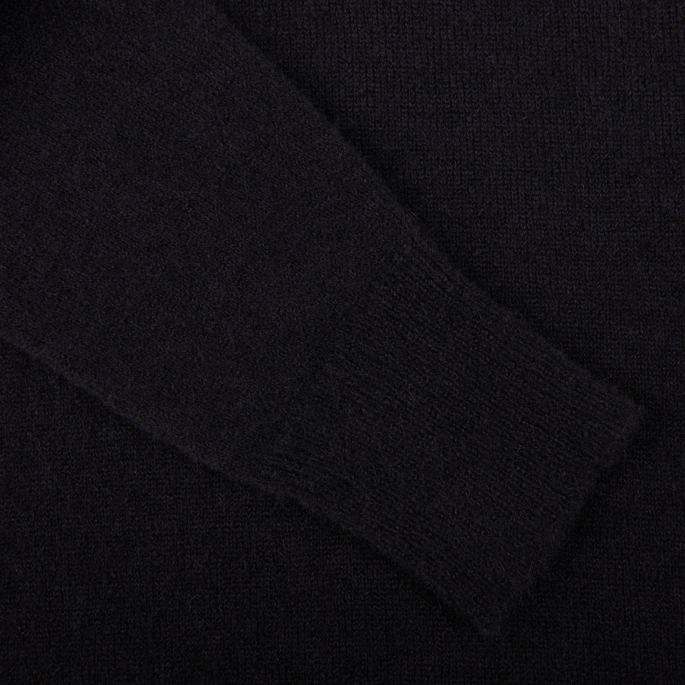 A close up of an Altea navy blue wool alpaca crewneck sweater.