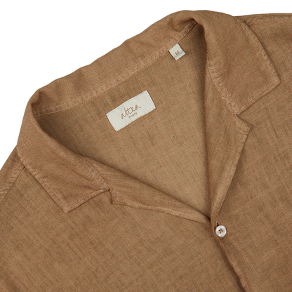 Close-up of an Altea Tobacco Brown Linen Blend Camp Collar Shirt with a visible label and mother-of-pearl button.