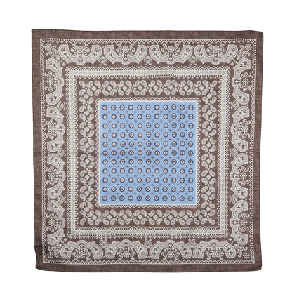 Decorative square bandana with blue center and intricate Brown Melange paisley pattern on a plain background by Amanda Christensen.