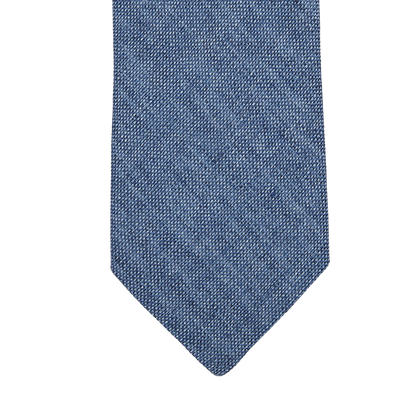 An Amanda Christensen Denim Blue Melange Linen Lined Tie in a denim blue shade on a white background.