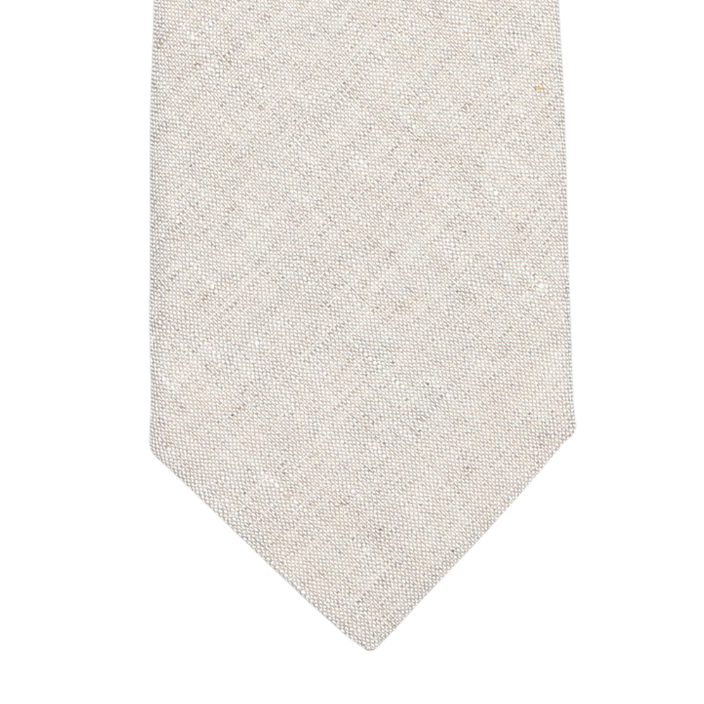 Close-up of a beige textured fabric with subtle diagonal patterns, evocative of an elegant Light Beige Melange Linen Lined Tie by Amanda Christensen, crafted in Italy.