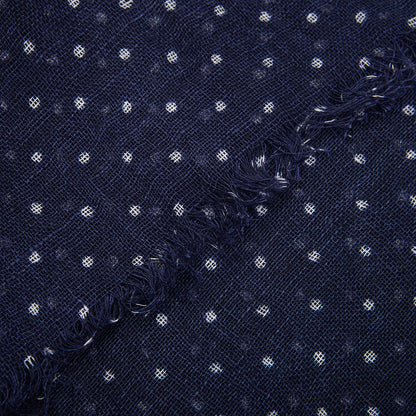 Close-up of a frayed edge on an Amanda Christensen Navy Blue White Dot Linen Gauze Scarf.
