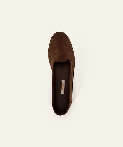 A single Dark Brown Suede Friulane Certosa by Azaleri is shown from above on a plain off-white background. This slip-on loafer features a rounded toe, minimal stitching, and a visible branded insole tag. , available at Richard Gelding Mayfair