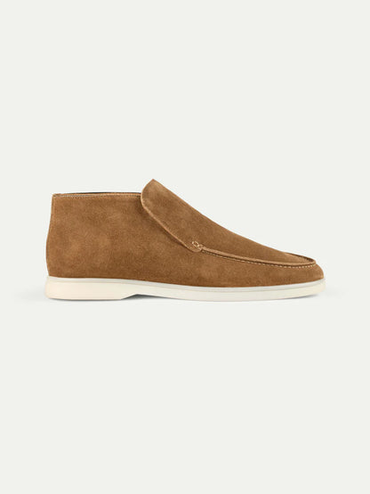 The Beige Softey Suede City Loafer by Aurélien features beige suede, visible stitching, a rounded toe, and a white rubber sole. This minimal, laceless design combines smart luxury with effortless elegance. , available at Richard Gelding Mayfair
