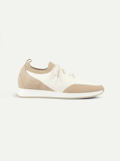 Aurélien’s Light Beige Active Knit Wool Sneakers feature a beige and off-white knit upper, beige heel and toe panels, white laces and sole. The low-top minimalist design has subtle stitching, a pull tab at the heel, and is shown on a white background. , available at Richard Gelding Mayfair