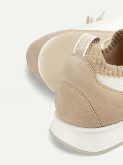 Close-up of Aurélien Light Beige Active Knit Wool Sneakers featuring a suede heel, Cashwool ribbed knit upper, white pull tab with cursive branding, and textured rubber sole—blending casual luxury in soft neutral hues. , available at Richard Gelding Mayfair