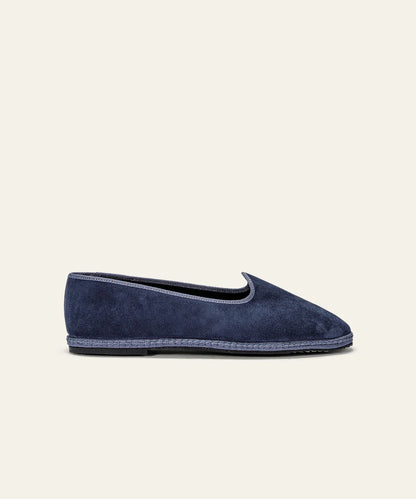 The Space Blue Suede Friulane Certosa by Azaleri is a single navy suede loafer featuring a low heel, rounded toe, and visible sole stitching, shown in profile against an off-white background. , available at Richard Gelding Mayfair