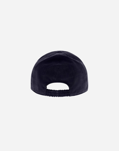 A plain dark navy Herno Navy Wool/Silk/Linen Loro Piana Woven Cap is shown from the back with an elasticated strap at the bottom center, set against a light gray background and no visible logos or decorations. , available at Richard Gelding Mayfair