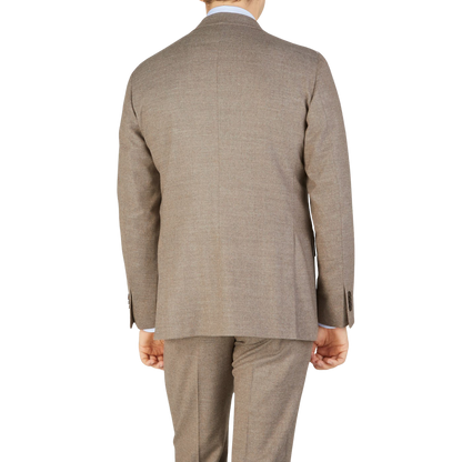 The back view of an elegant man in a Beige Grey Wool Flannel K Suit made by Boglioli.