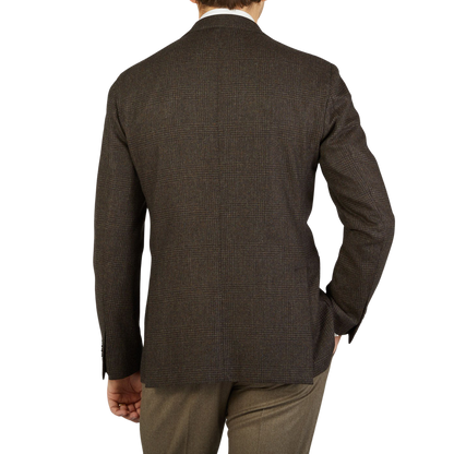 The back view of a man in a Boglioli K Jacket brown blazer, showcasing its unstructured craftsmanship and elegant made in Italy design.