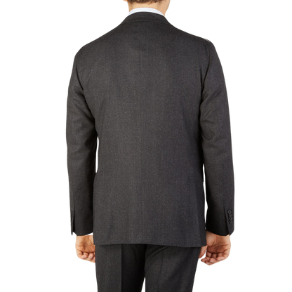A man displaying the understated elegance of a Boglioli Charcoal Grey Wool Flannel K Suit.