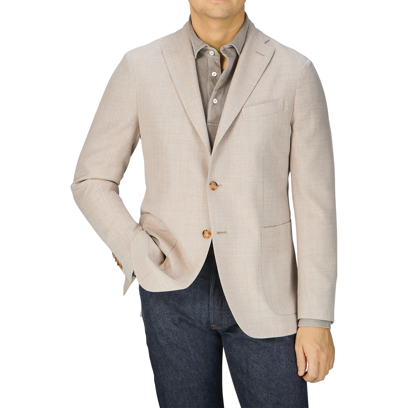 A man in a Boglioli Cream Beige Wool Hopsack K Jacket and jeans showcases unstructured craftsmanship.