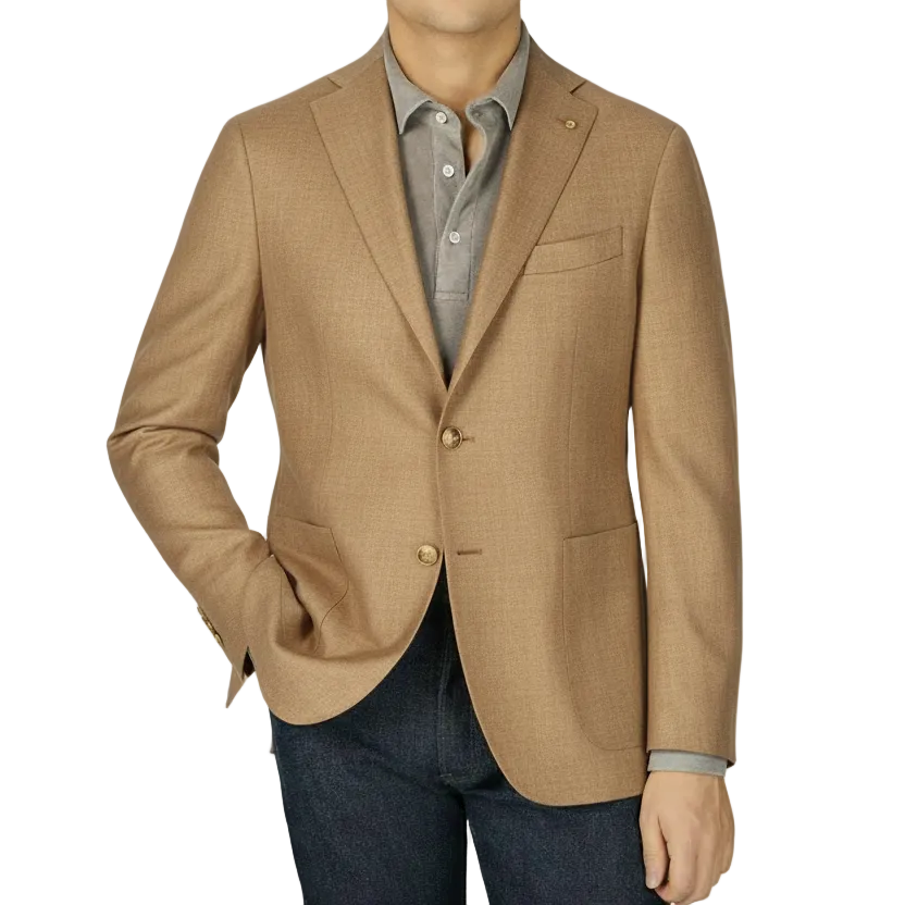 A man in a Boglioli Cream Beige Wool Hopsack K Jacket and jeans showcases unstructured craftsmanship.